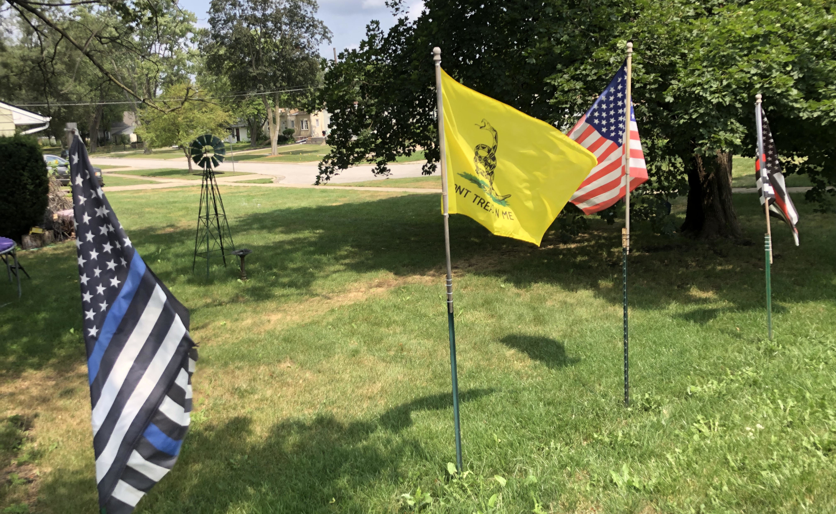 Four flags of a United States in distress.